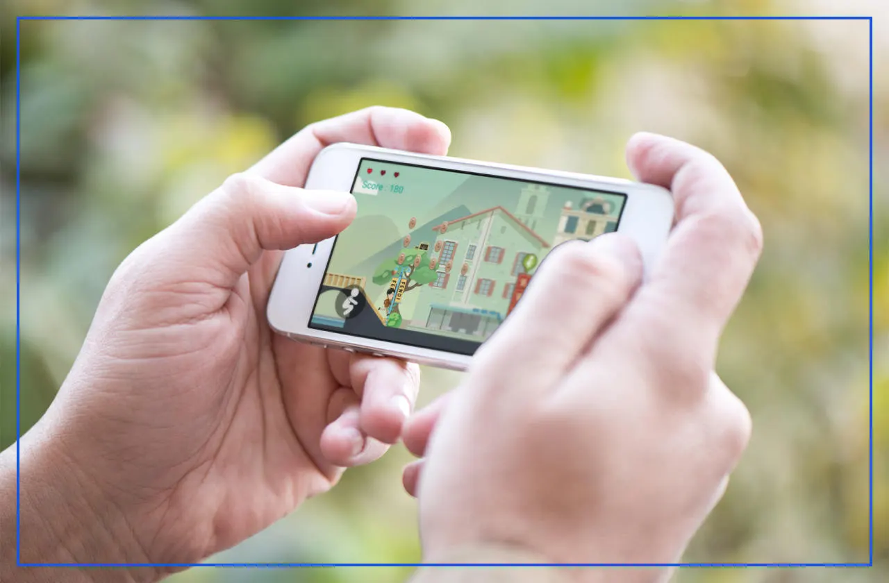 Hands holding a phone playing a side-scrolling mini game in a street lined with European buildings