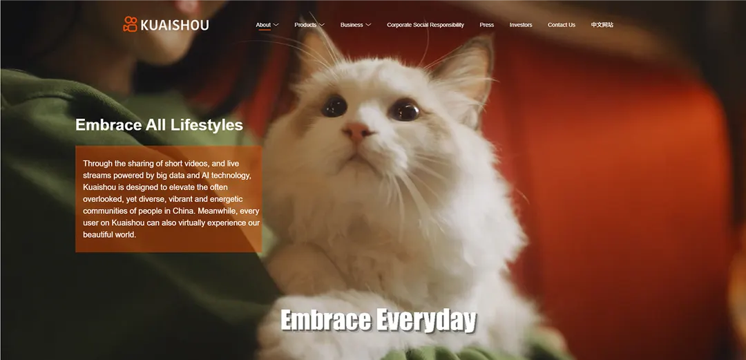 Kuaishou corporate website home page with a white cat and the slogan Embrace All Lifestyles