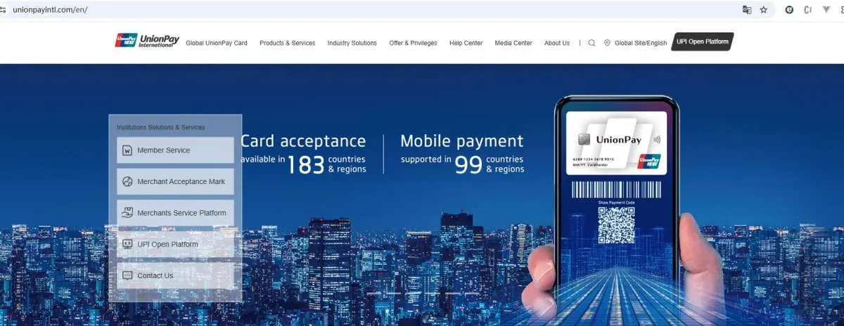 UnionPay International website home page with card acceptance in 183 countries and regions and a phone showing a UnionPay payment code
